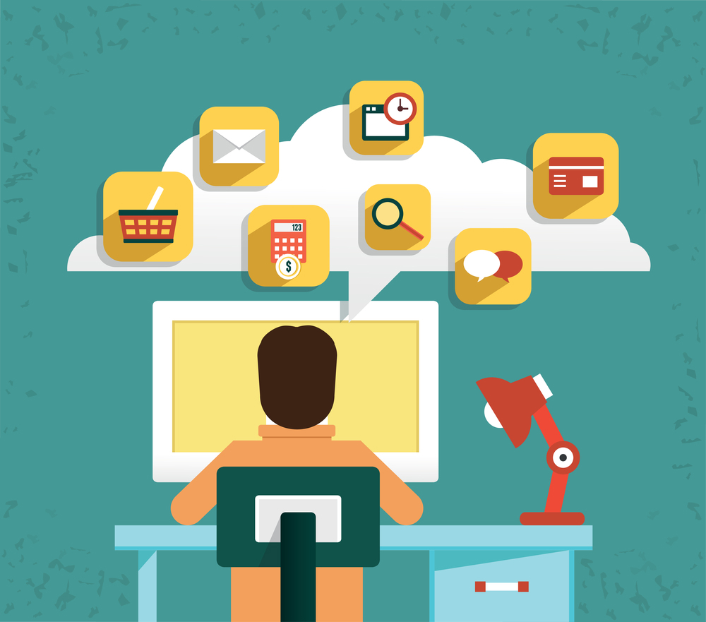 Man at desk with technology floating above in a cloud